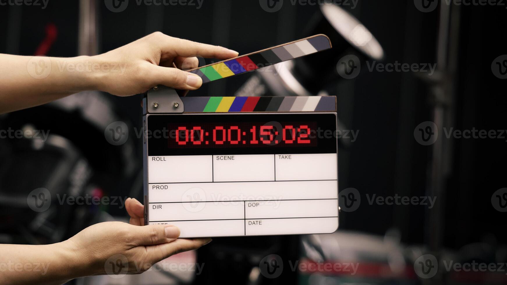 Hand, hitting timecode clapperboard or movie slate for Production. photo