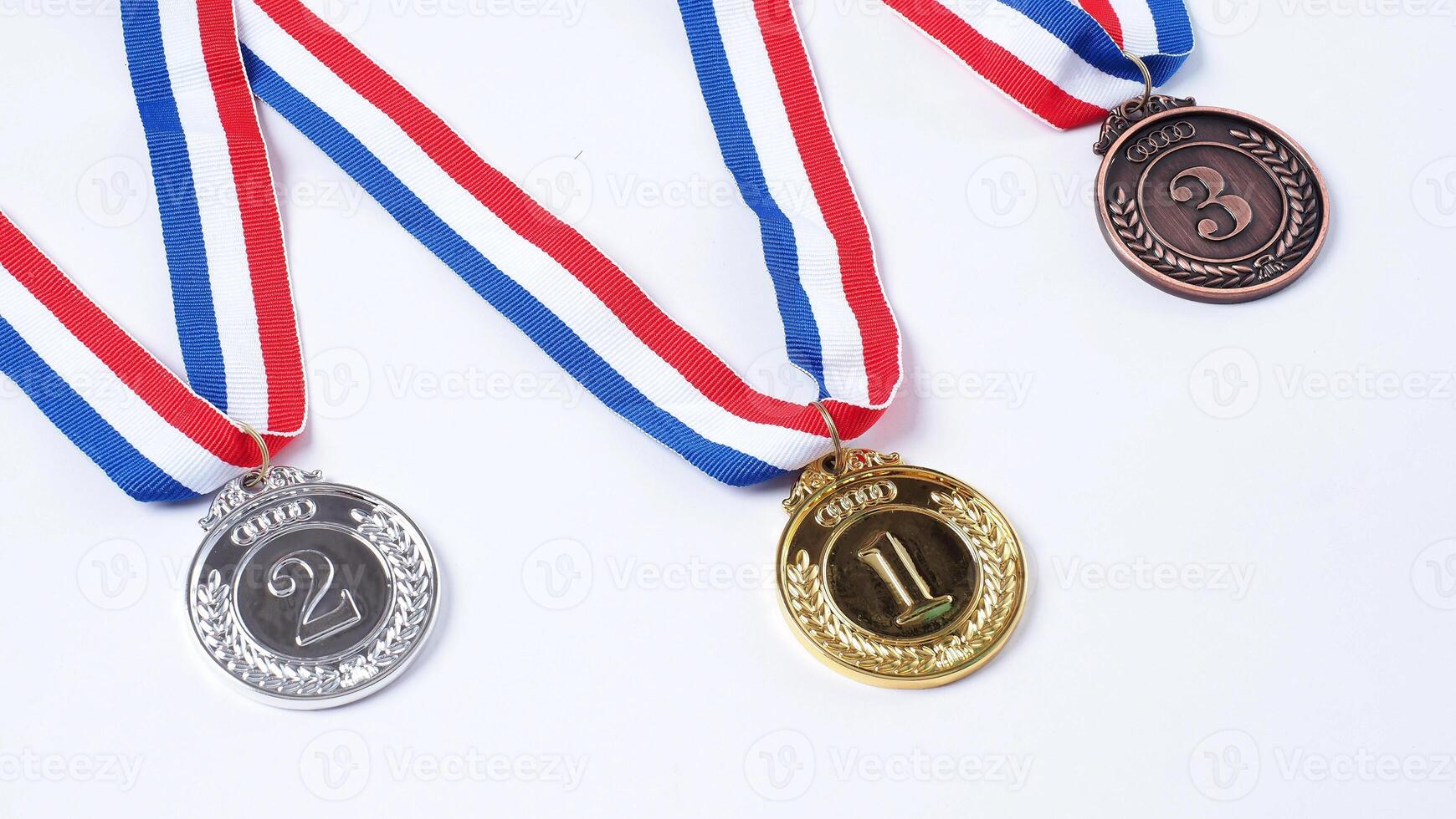 Gold silver and bronze demonstration trophy medals with ribbon. photo