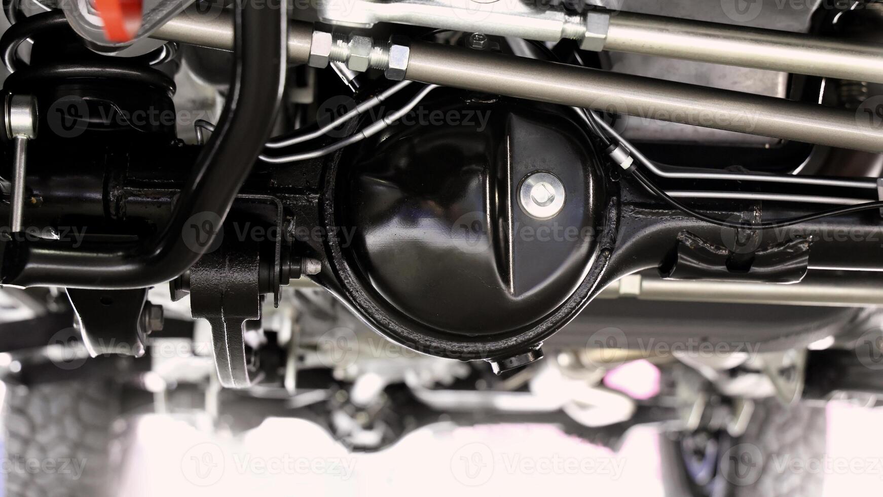 Car suspension part. Close up of a rear car suspension and exhaust system, photo