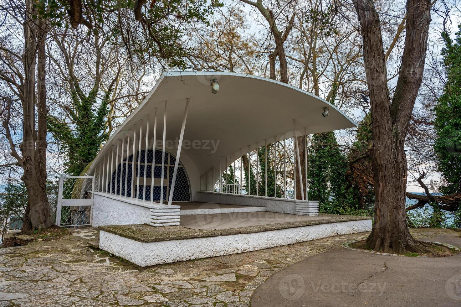 unique architectural structure nestled amongst trees. Stage for outdoor performance photo