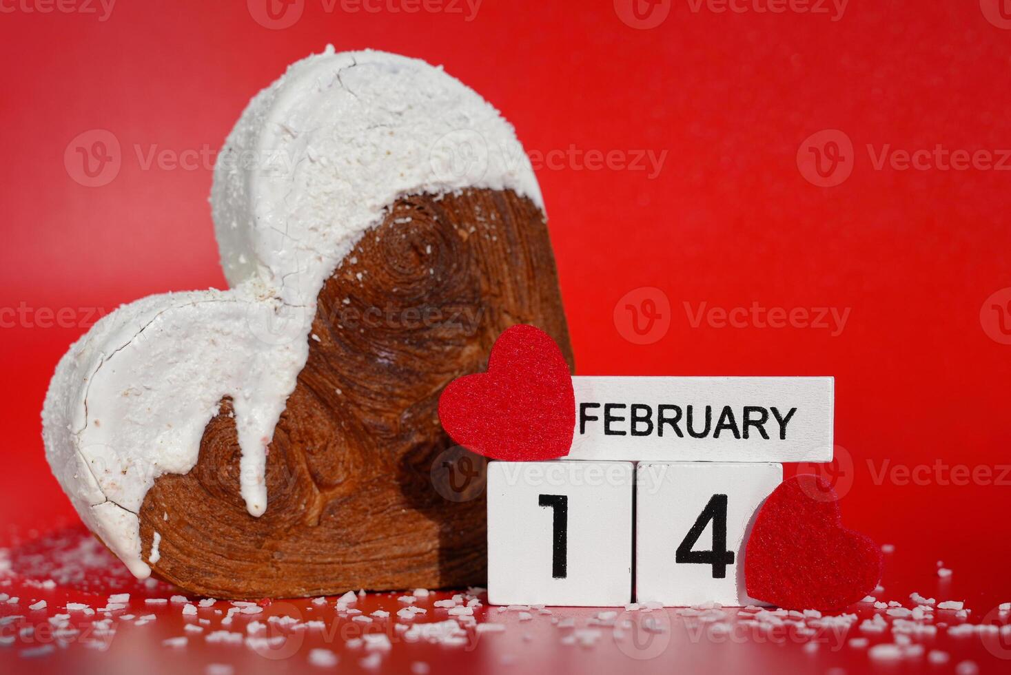 14 February international valentine's day love holiday celebration gift present idea Heart shaped coconut flavor croissant on red background with copy space. Puff pastry new trendy sweet dessert bakery. Creamy dough experiment photo