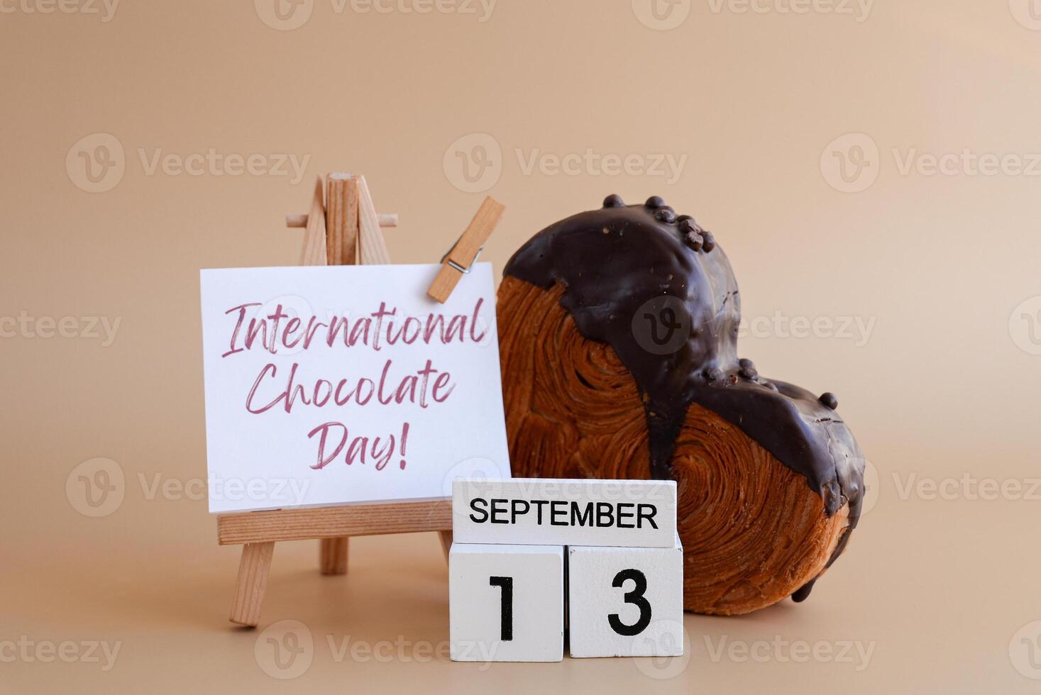 Calendar date 13 September international chocolate day greeting card Delicious fresh croissant topped with colorful flavor Ganache. Creation unique heart shape bakery. Puff pastry holiday love gift present idea. Copy space photo