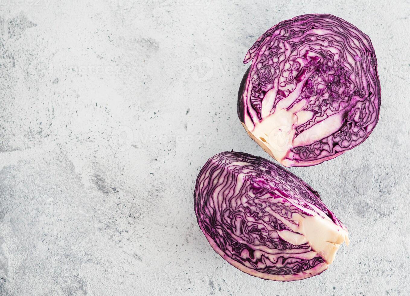 red cabbage on gray cement background. Top view of red cabbage on gray table with copy space for text. Background for healthy eat, vegetarian meny photo