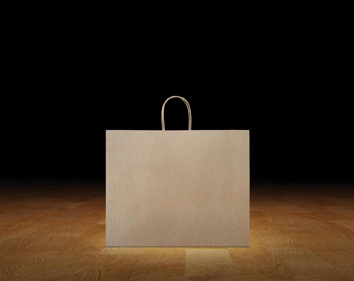 Large empty brown kraft paper bag isolated on wooden surface, black background. photo