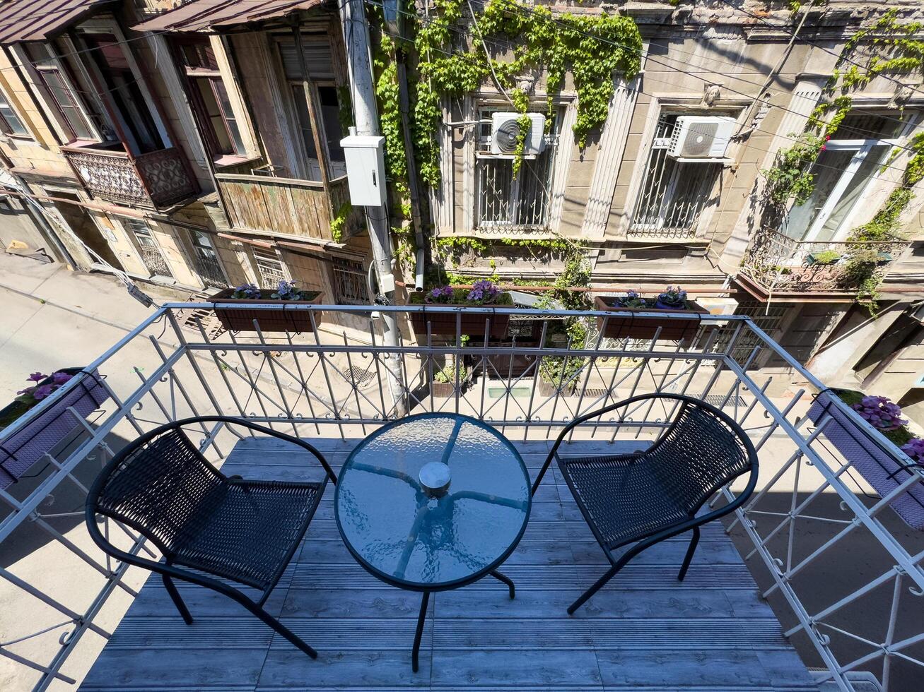 view of an old house balcony and the baroque town in the background photo