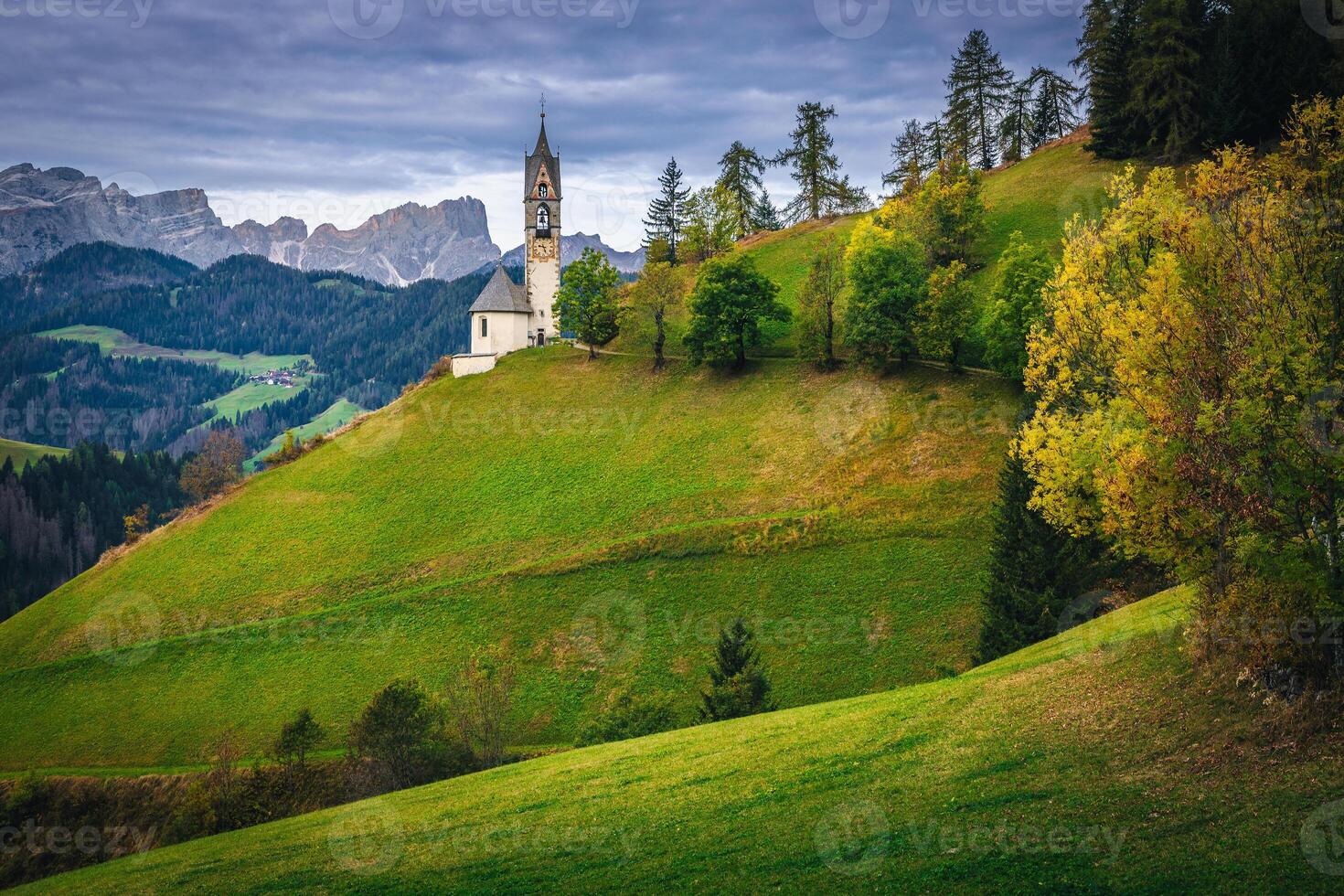 Chapel of St Barbara at early morning in Dolomites, Italy photo