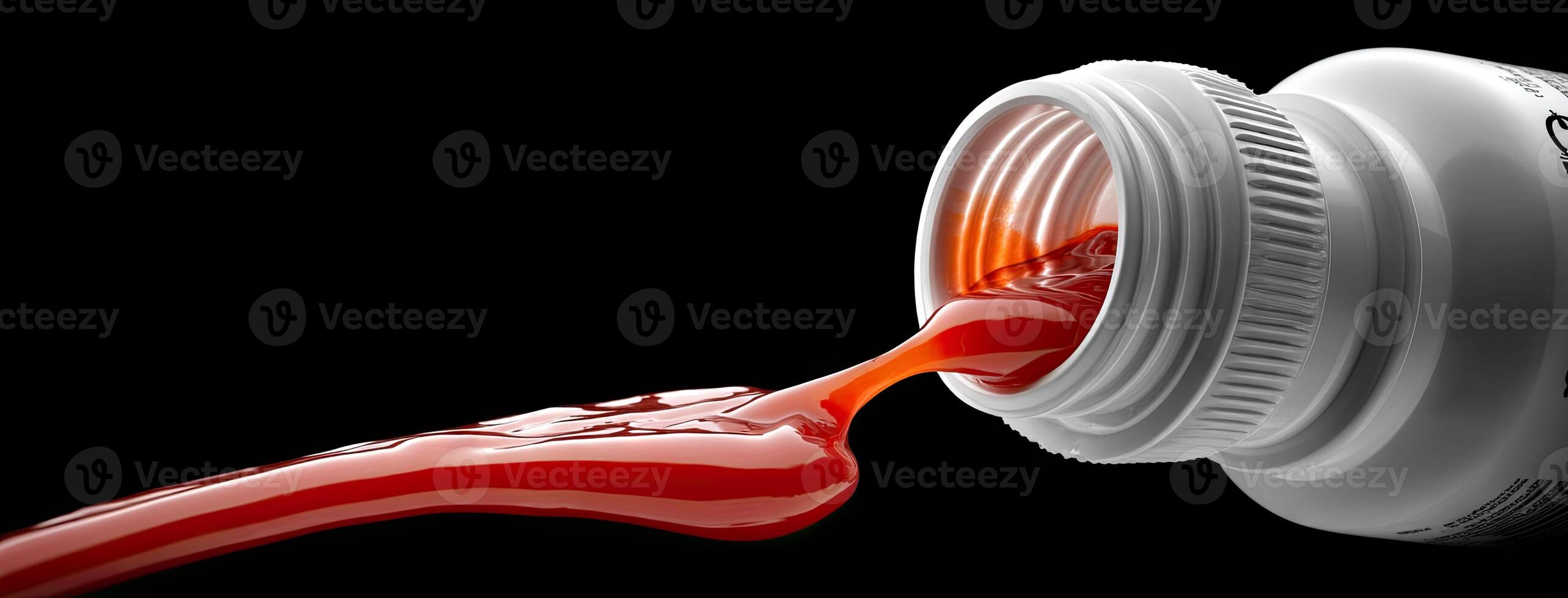 A red liquid is pouring out of a jar photo