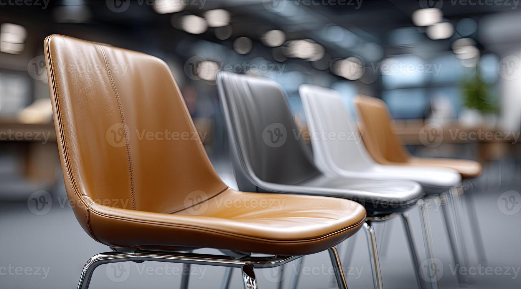 A row of chairs in a room with a table photo