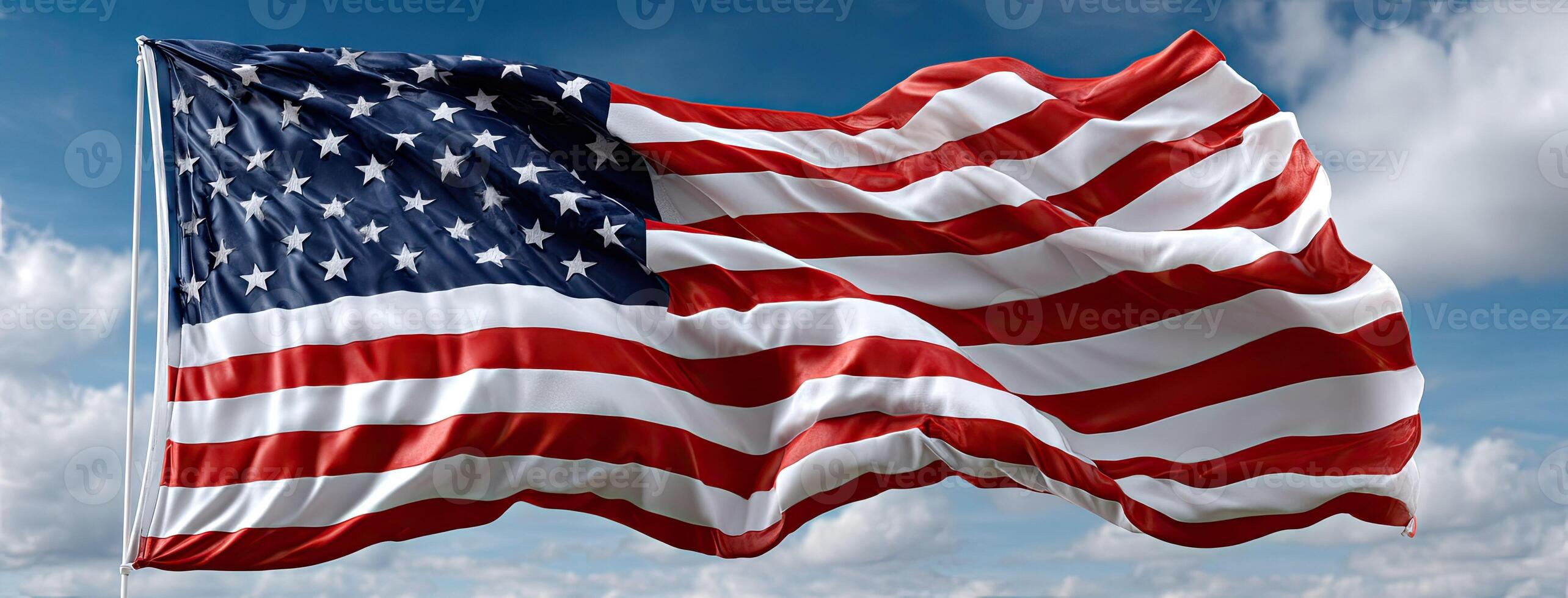 An american flag flying in the wind photo