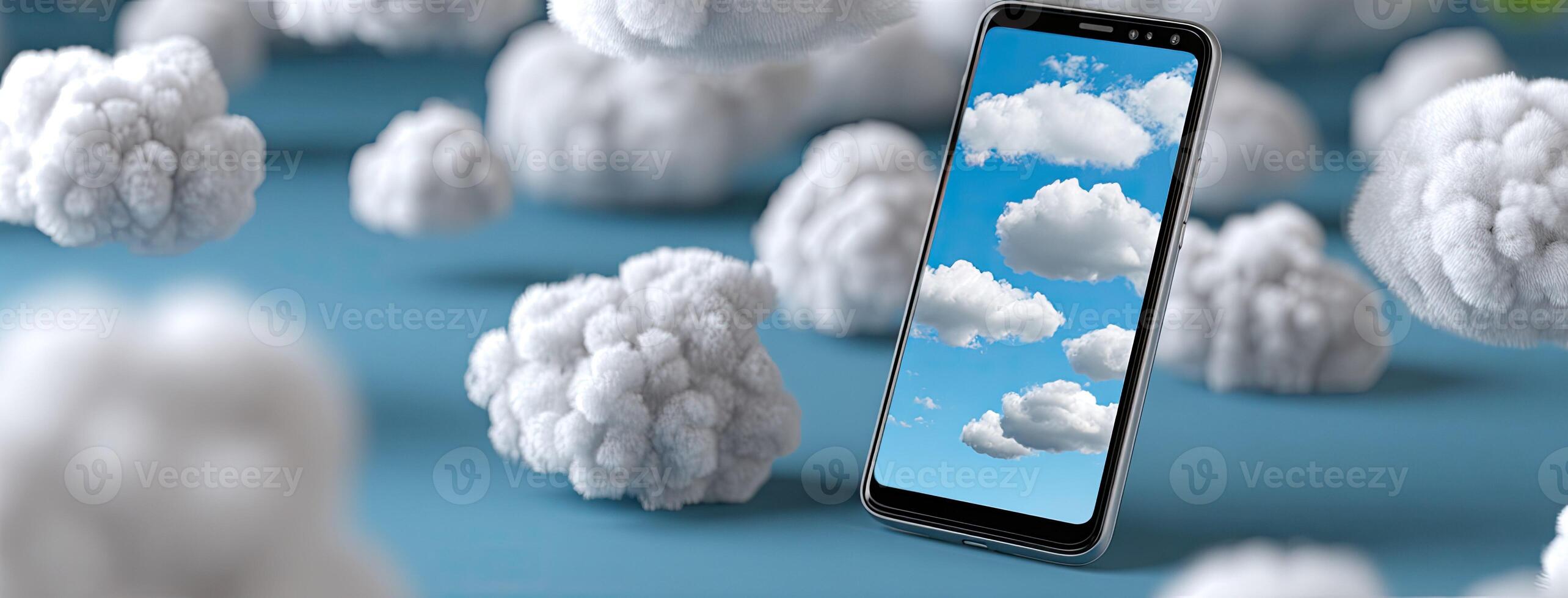 A smartphone is surrounded by clouds and a blue sky photo
