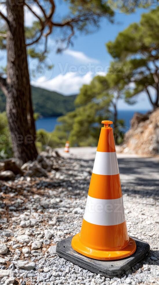 A traffic cone on the side of a road photo