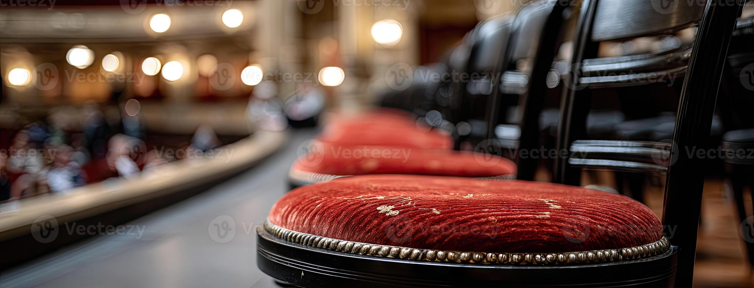 A row of chairs in front of a stage photo