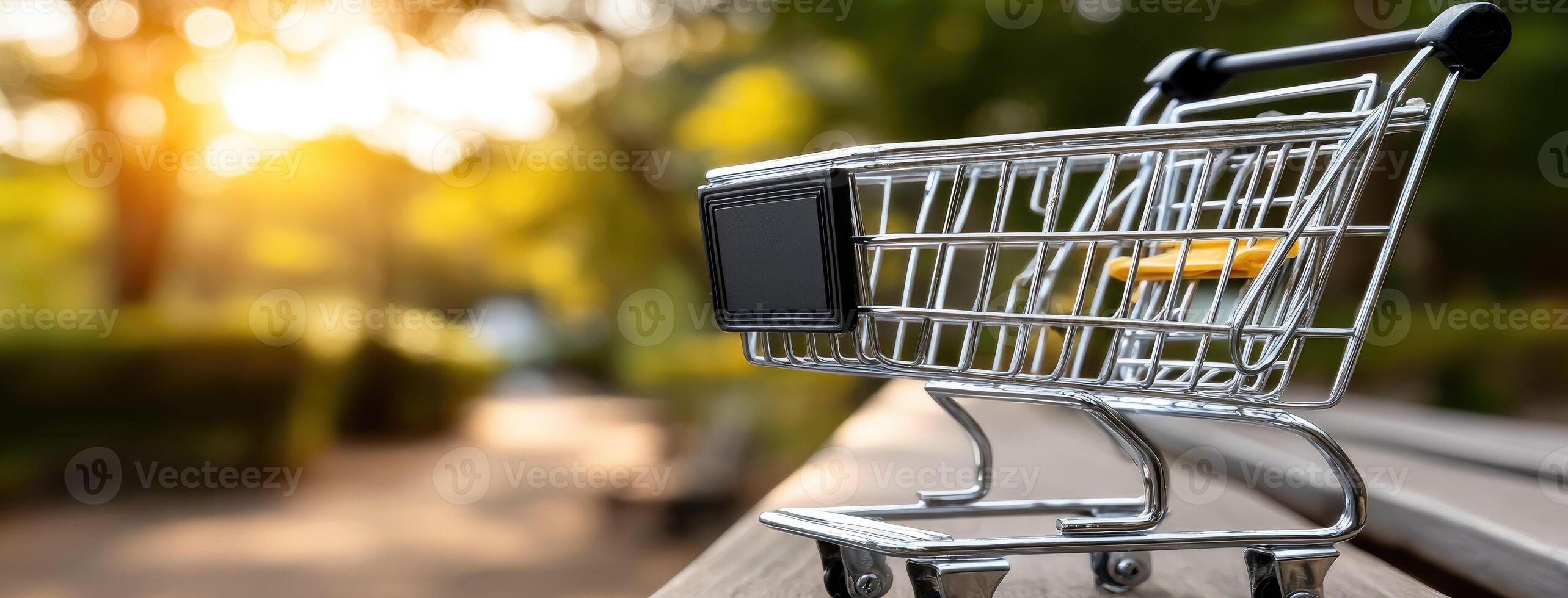 A shopping cart is sitting on a bench photo