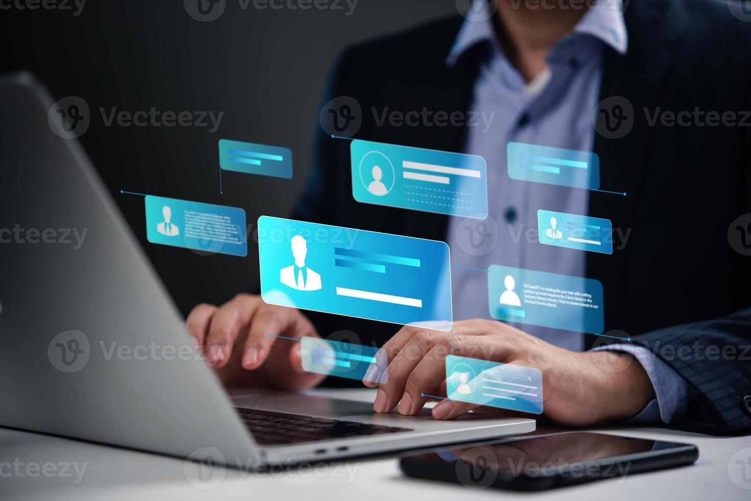 Man using laptop with social icons on screen photo