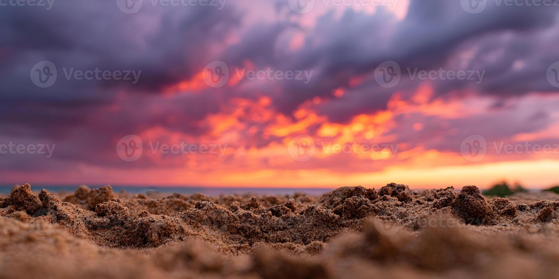Beach Sand Close Up with Vibrant Sunset Sky photo