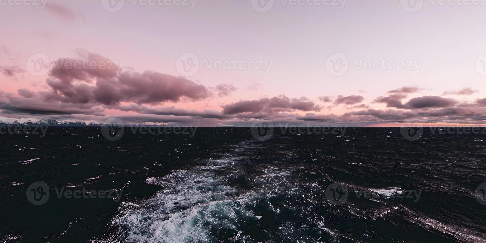 Ocean Waves Wake at Pink Sunset Mountains in Background photo