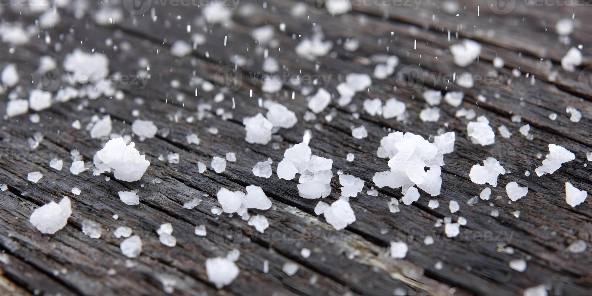 Closeup Hailstones on Dark Wood Surface Ice Crystals Winter Weather photo