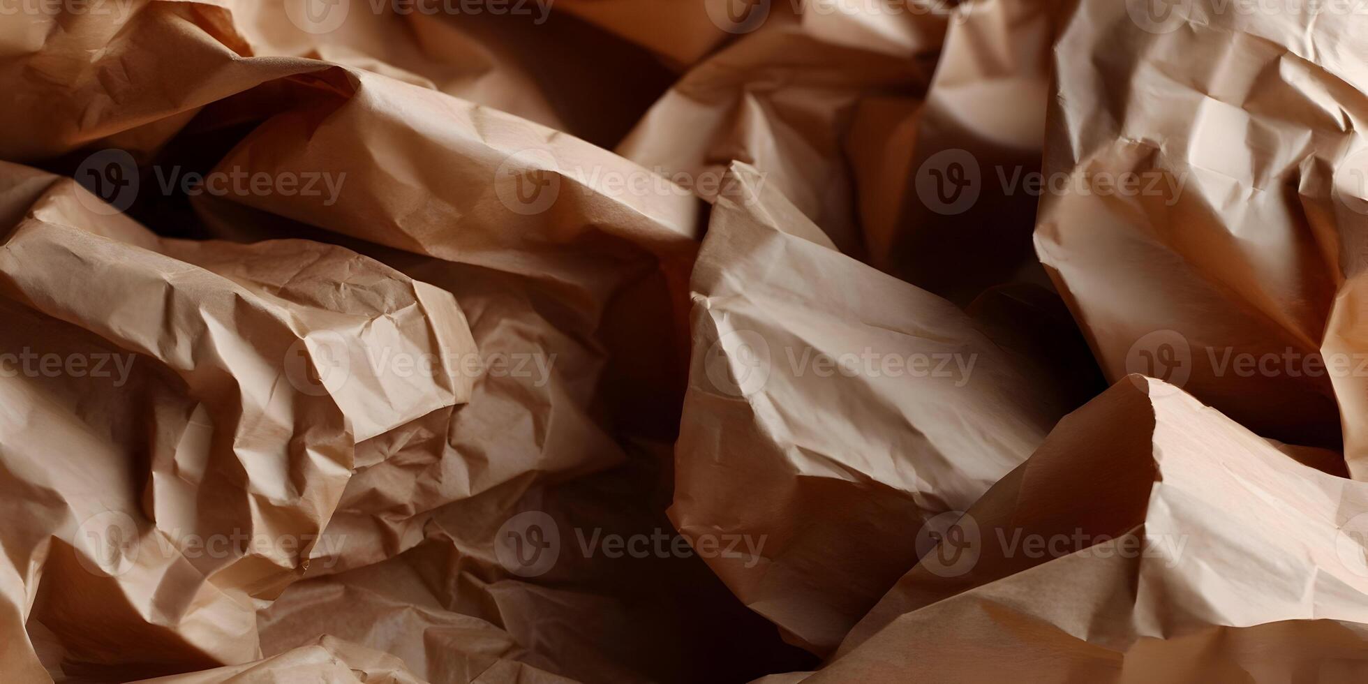 Textured brown paper with natural folds as a graphic design element photo