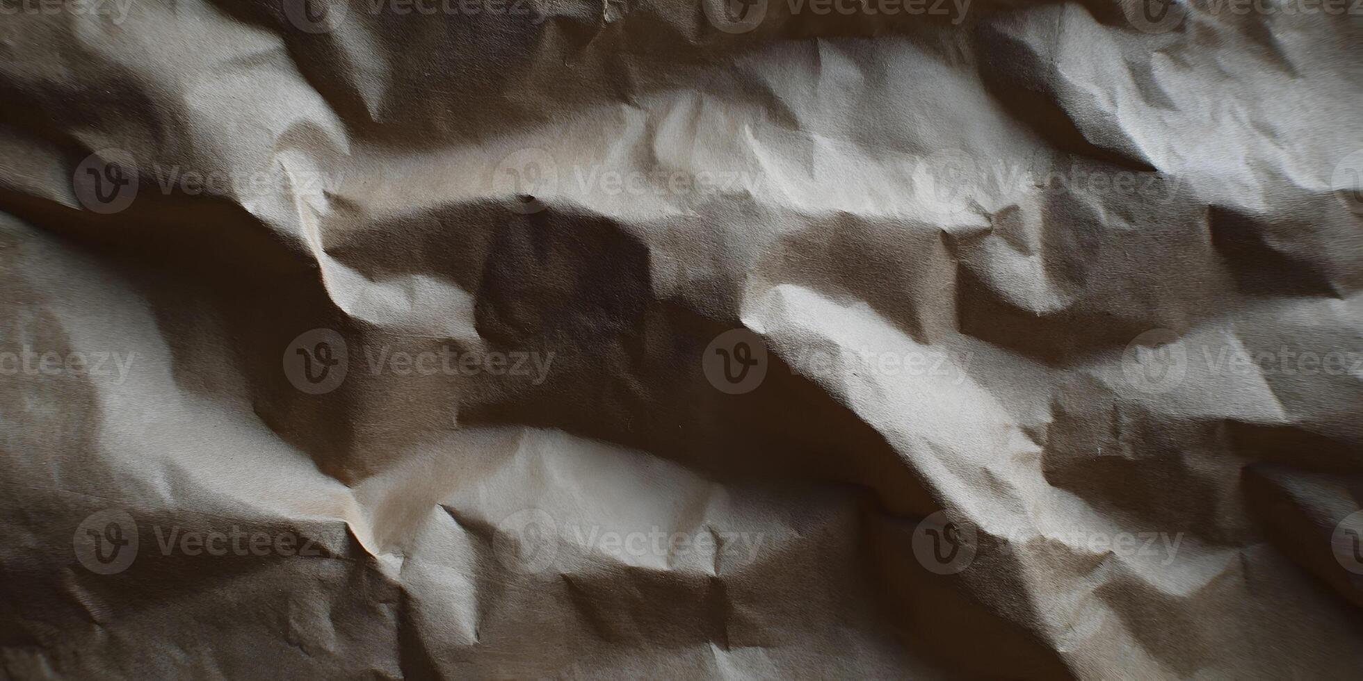 Crumpled brown paper texture serving as a background design element photo