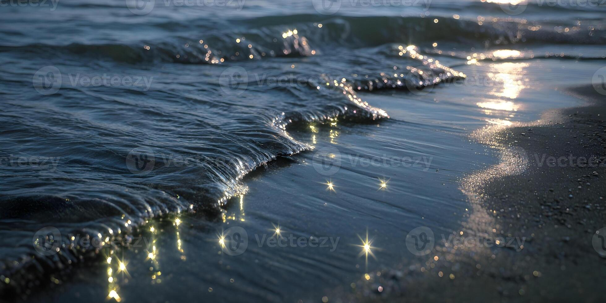 Ocean Wave on Sandy Beach at Sunset Sparkling Water Glimmering Light photo