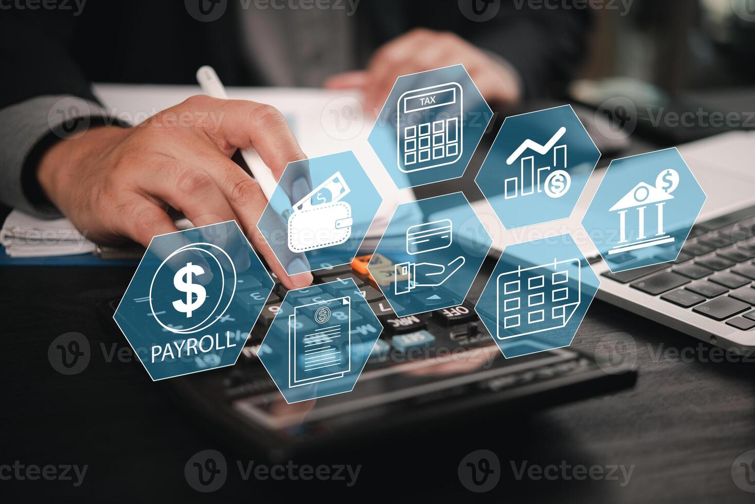 Businessman using calculator to calculate financial data photo
