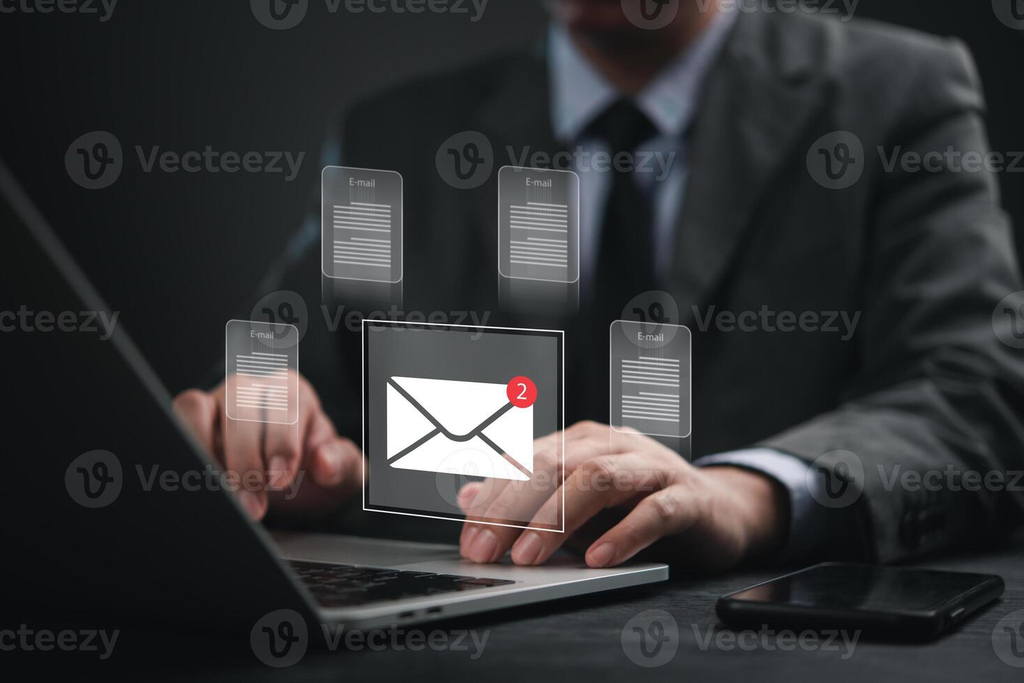 Email marketing concept - business man using laptop with email icons on screen photo