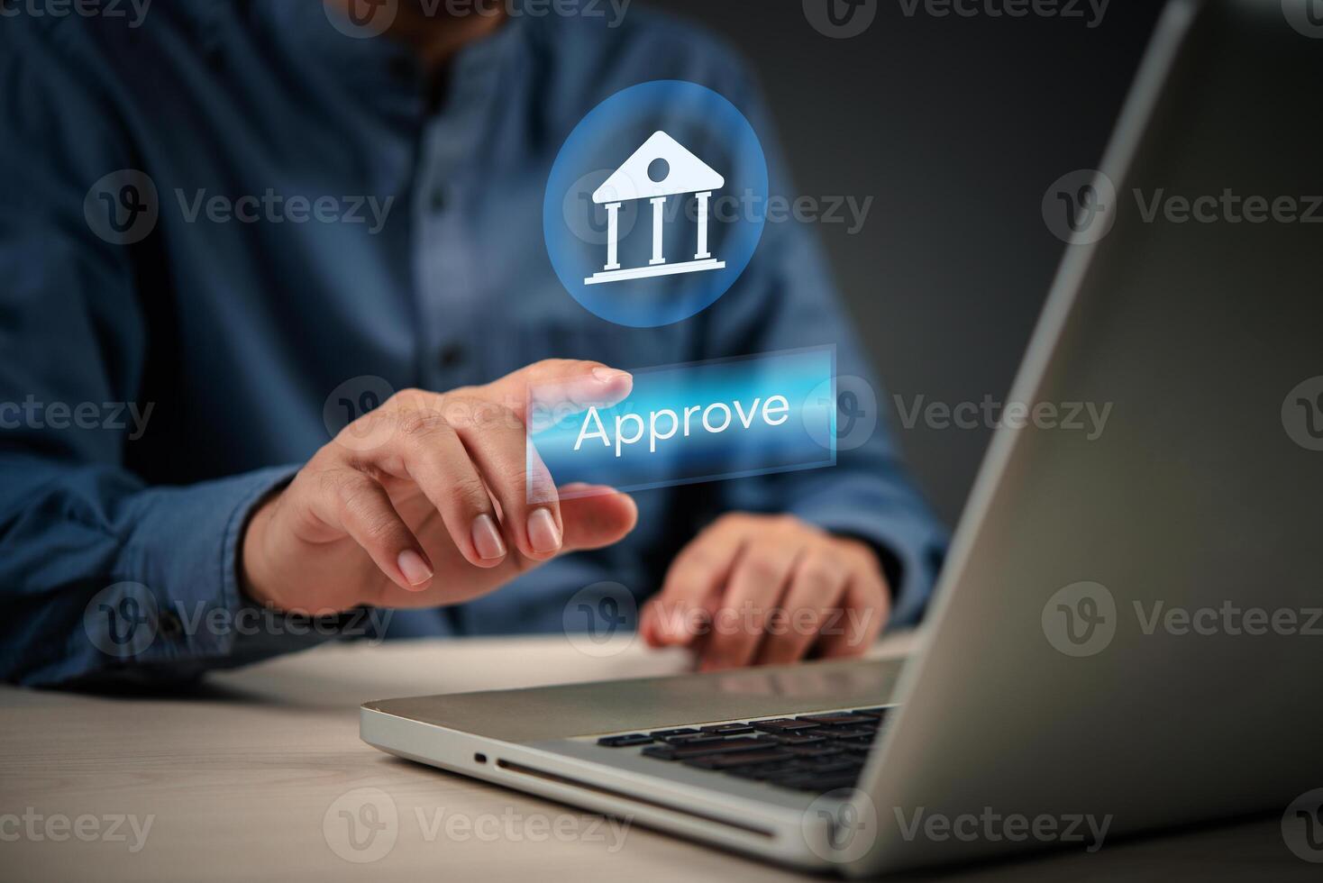 Man using laptop with approval button on screen photo