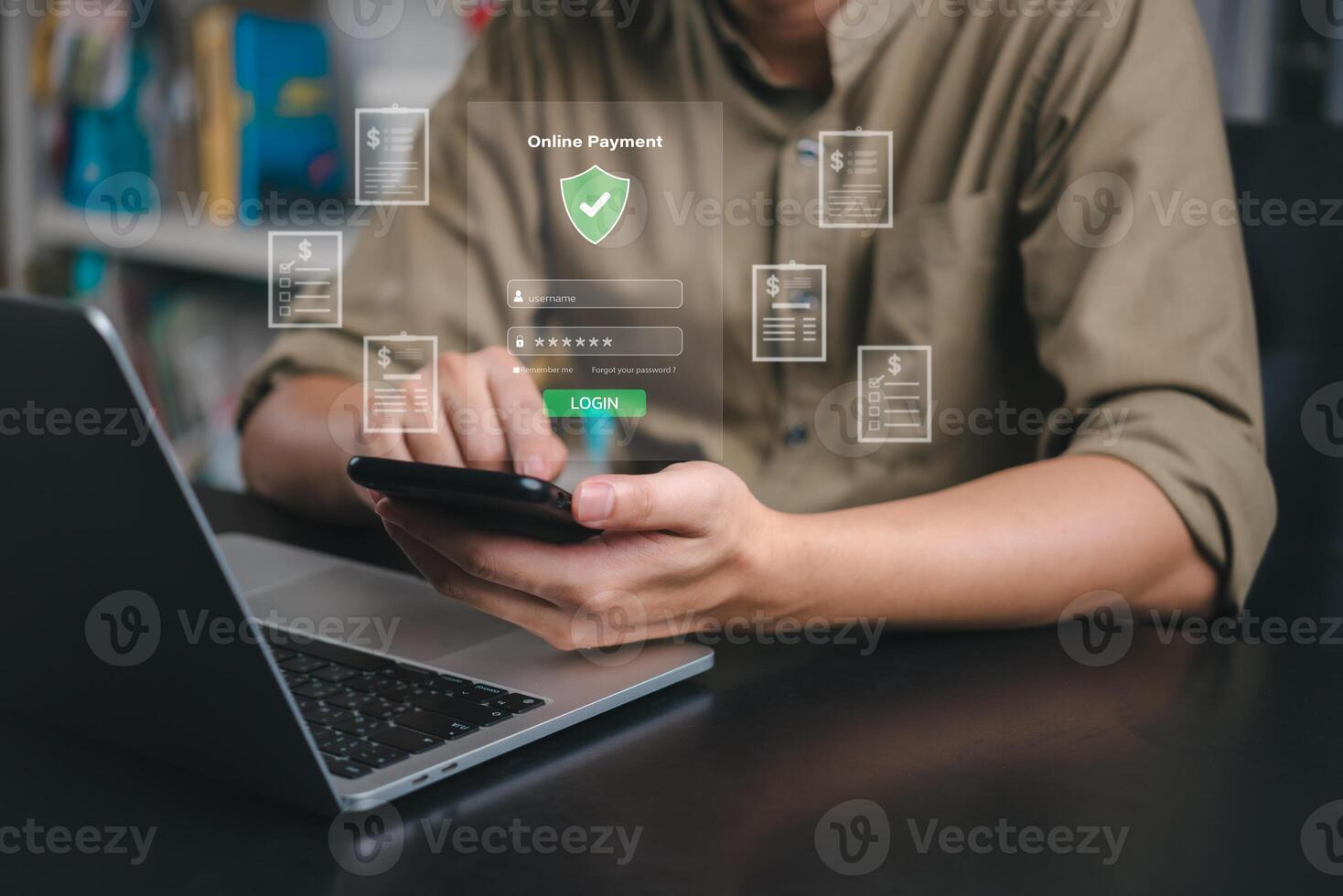 Man using smartphone and laptop with security icons photo