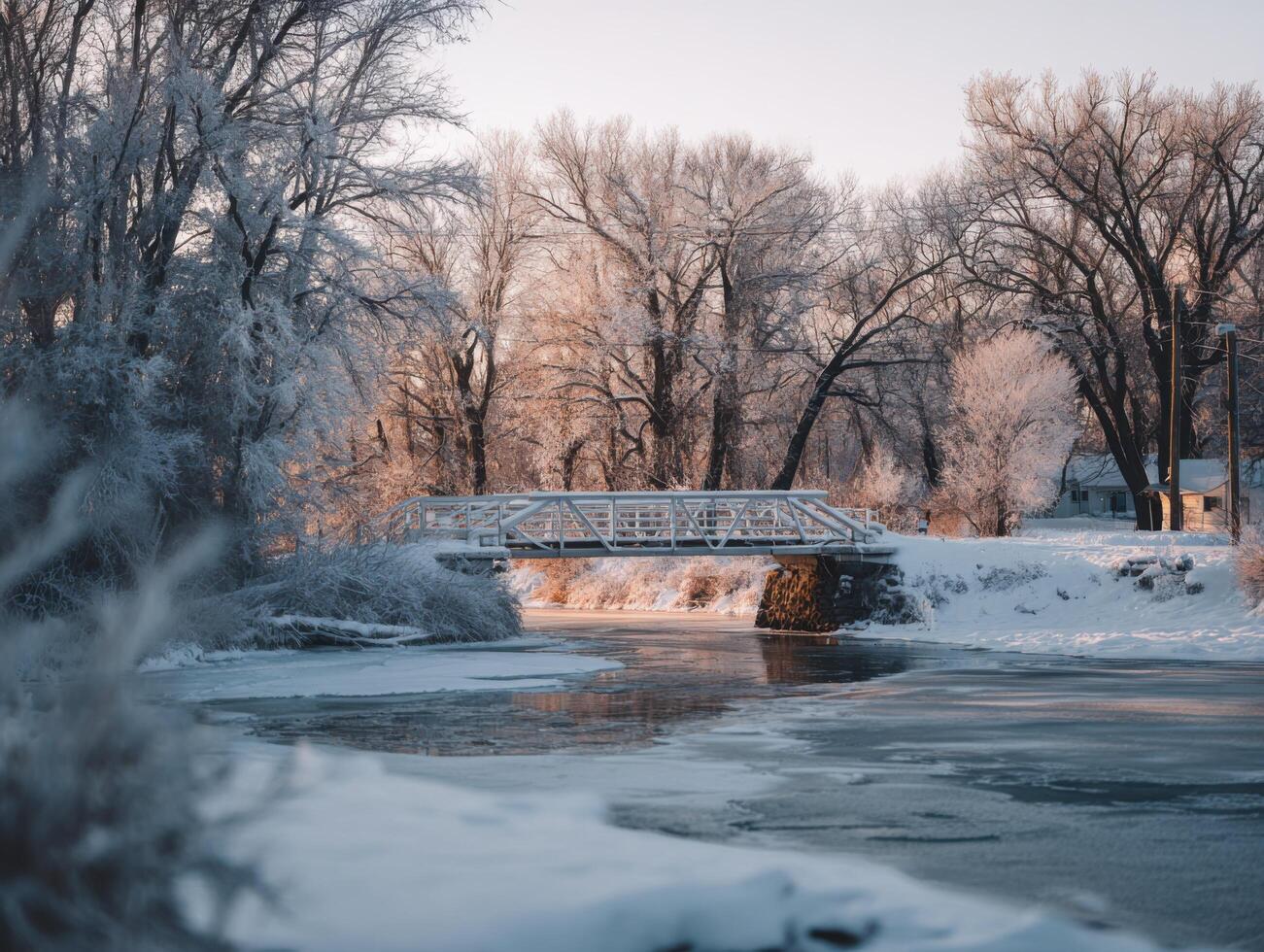 A Snowy Bridge Spanning A Frozen River photo