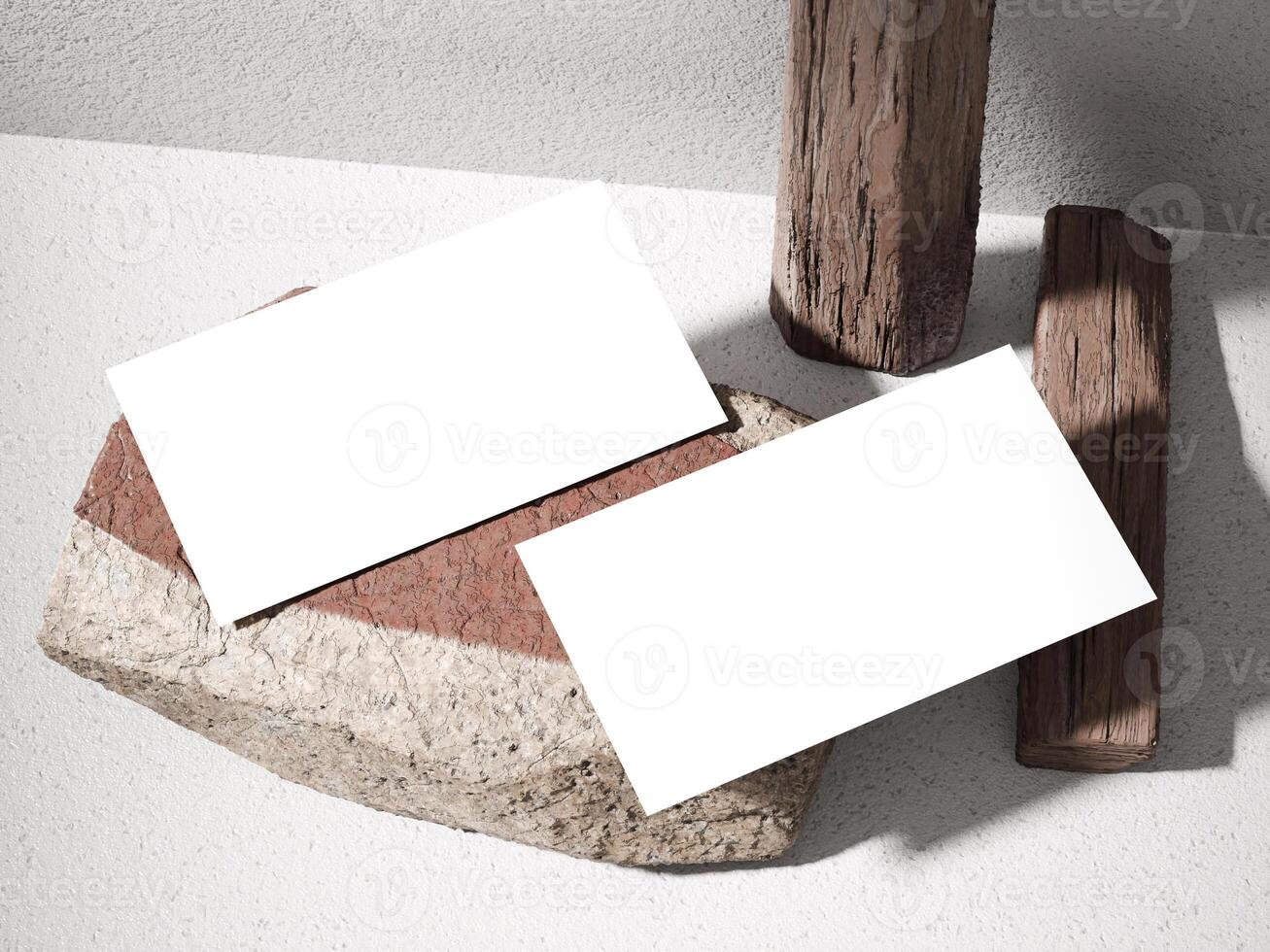 Business card mockup on a stone surface with wooden logs and soft natural lighting. photo