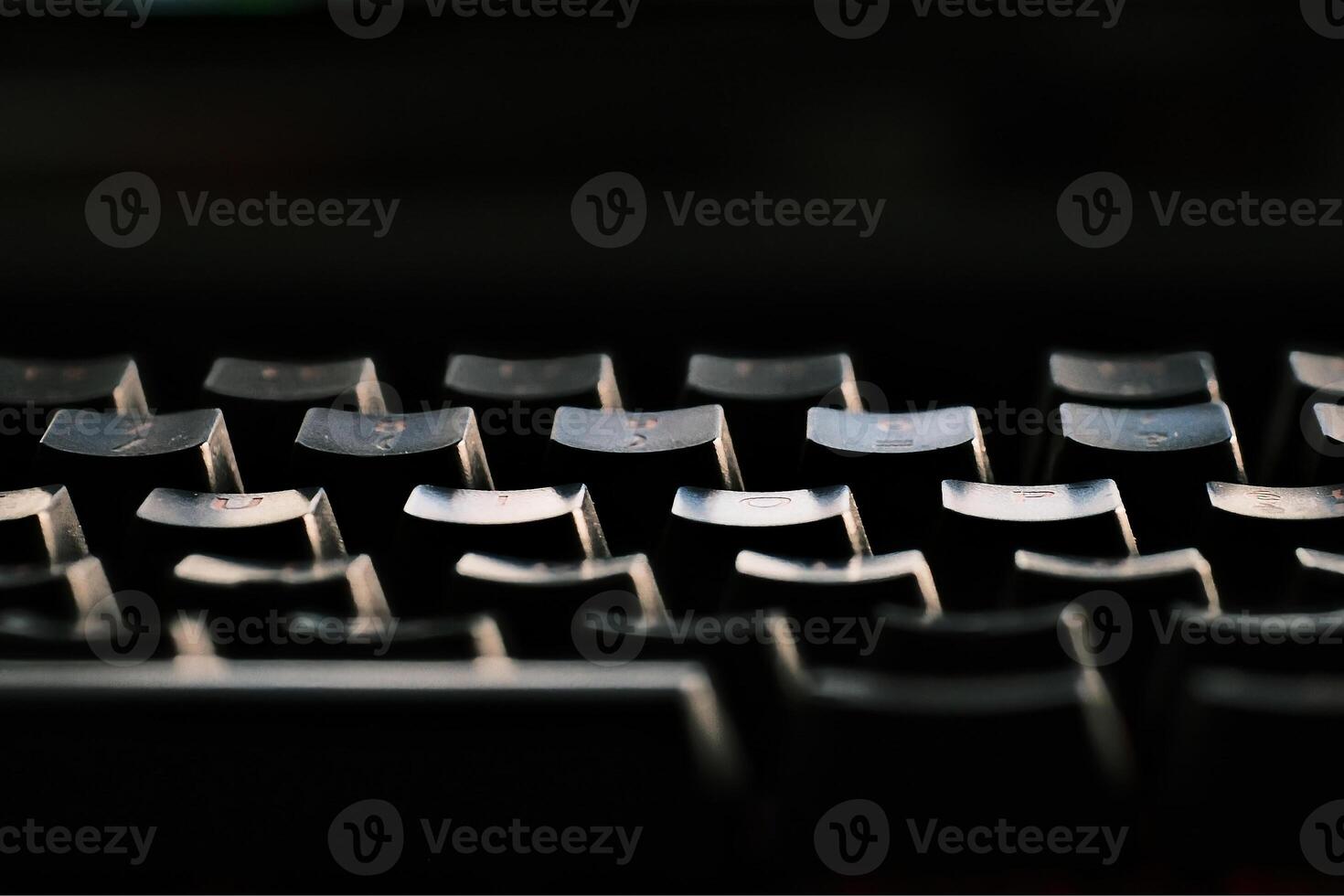 keys of a backlit pc keyboard on an Italian office desk photo
