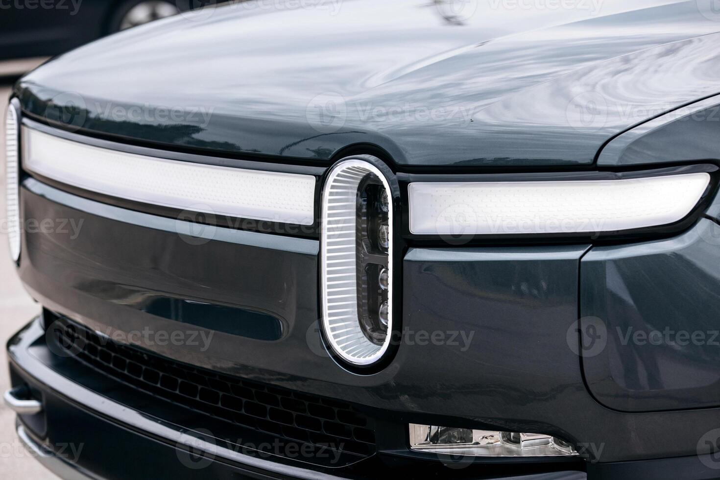 Close-up of a modern car headlight. Automotive parts concept. photo