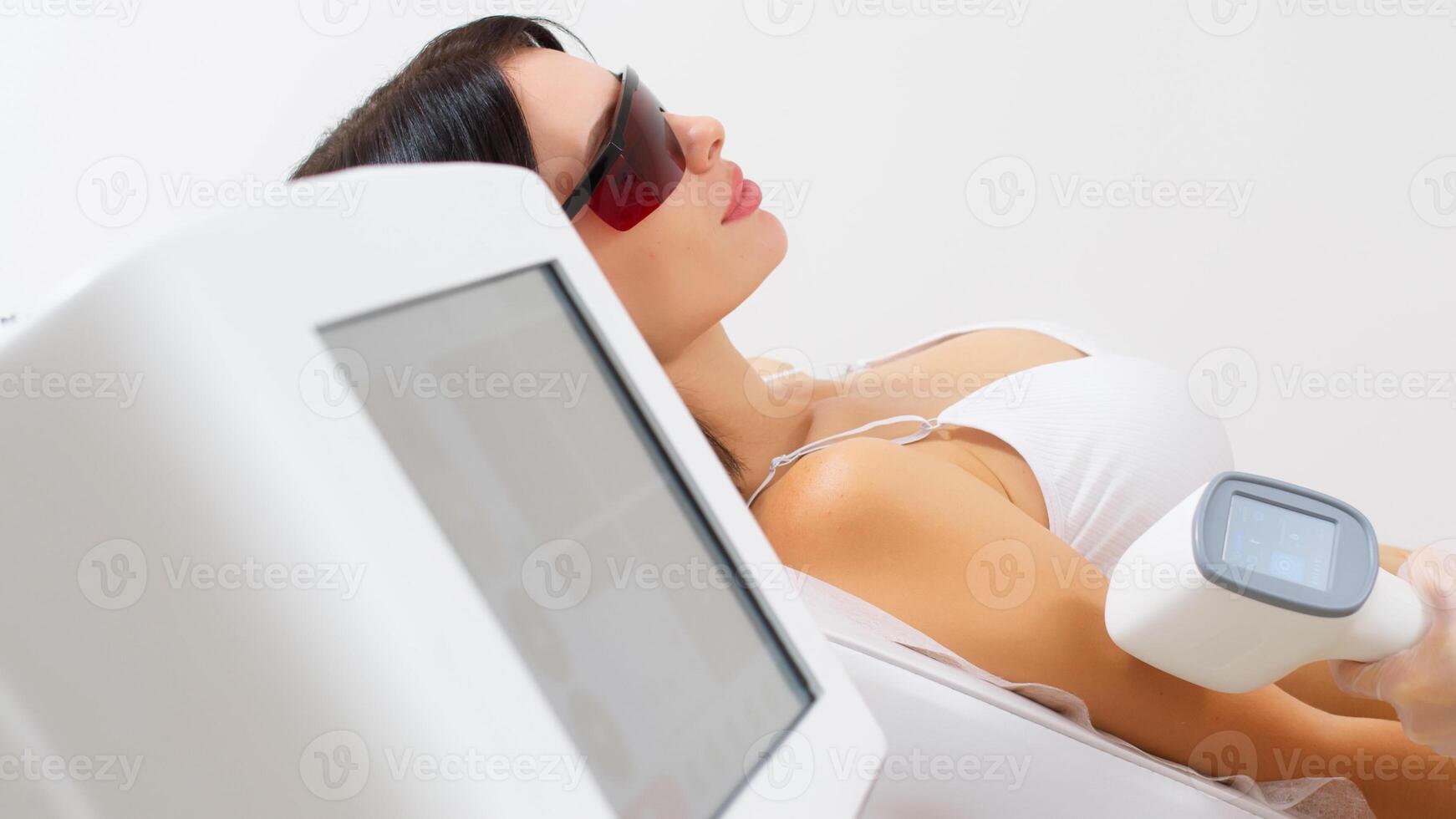 Hair removal-depilation. A young woman undergoes a laser hair removal procedure, close-up. photo