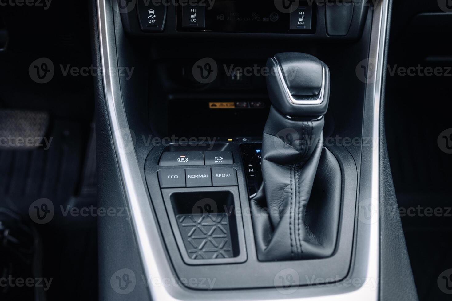 A close-up of the gearbox of a modern, new car. Concept of stylish design photo