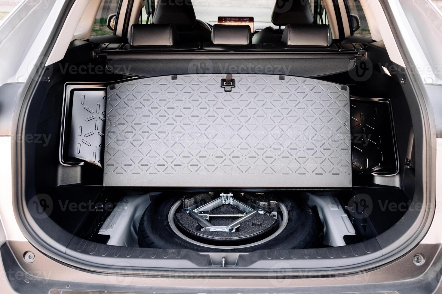 Spare wheel in the trunk of a modern car. photo