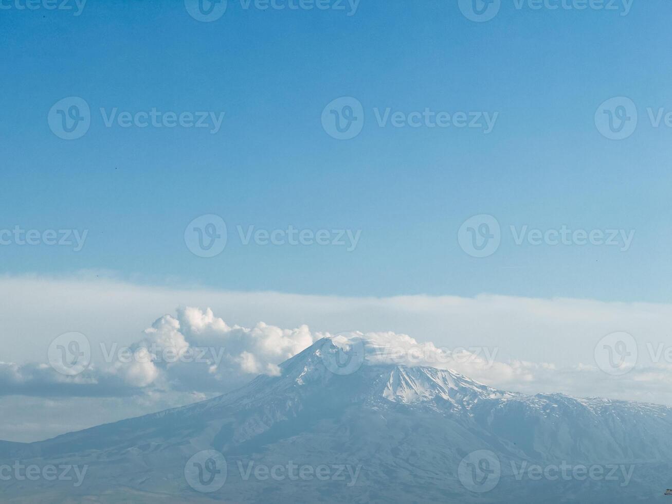 Mount Ararat with snow capped clouds photo