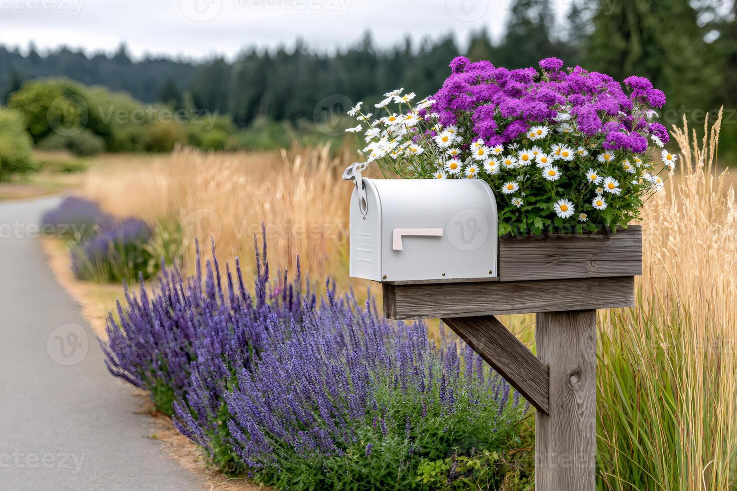 White mailbox with flowers decorating a country road photo