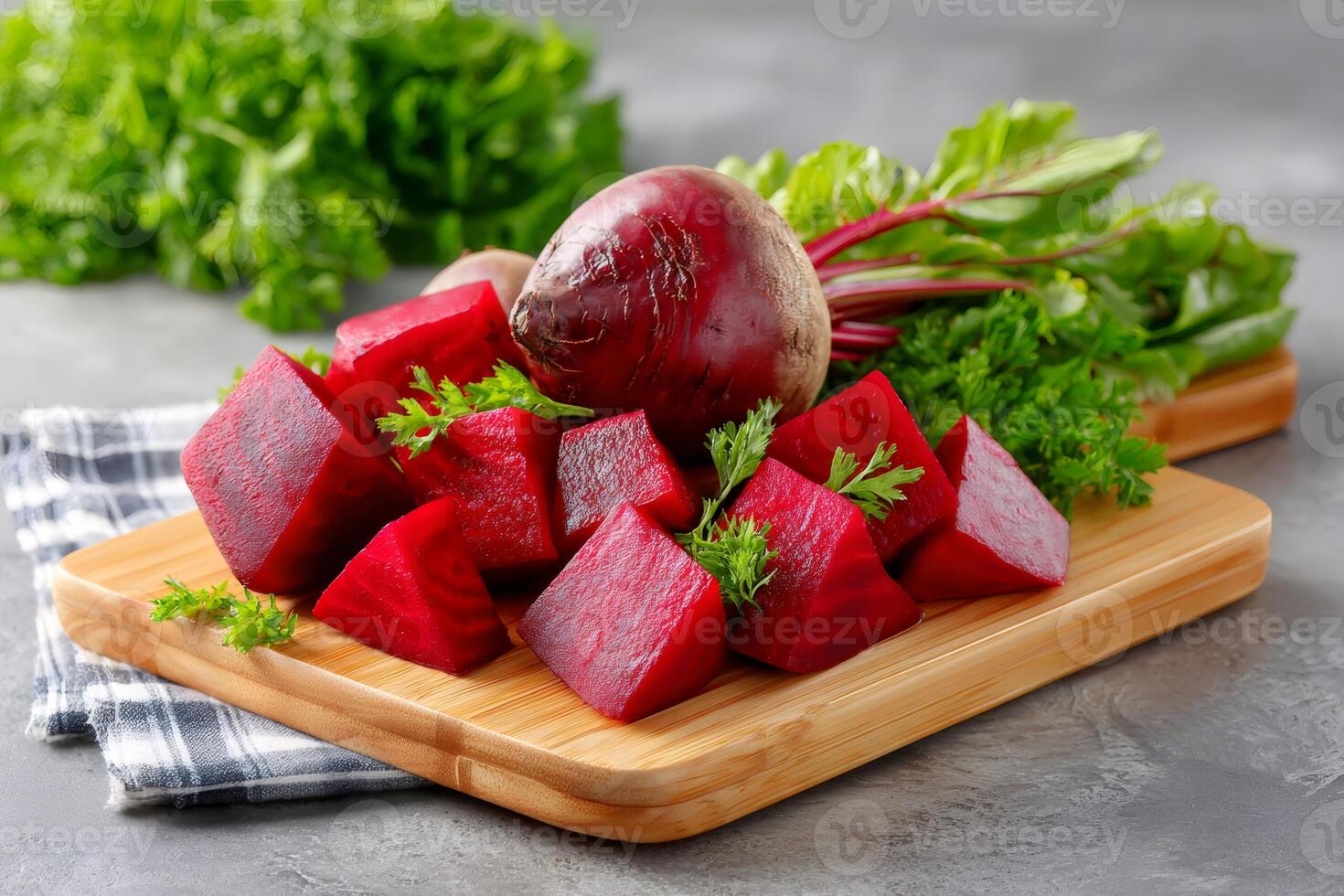 Fresh beetroots and parsley leaves resting on cutting board photo