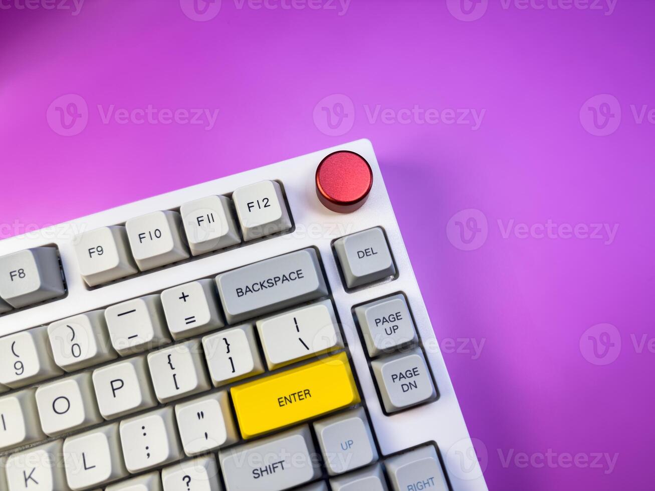 Gaming keyboard, isolated on purple background, copy space, flay lay photo