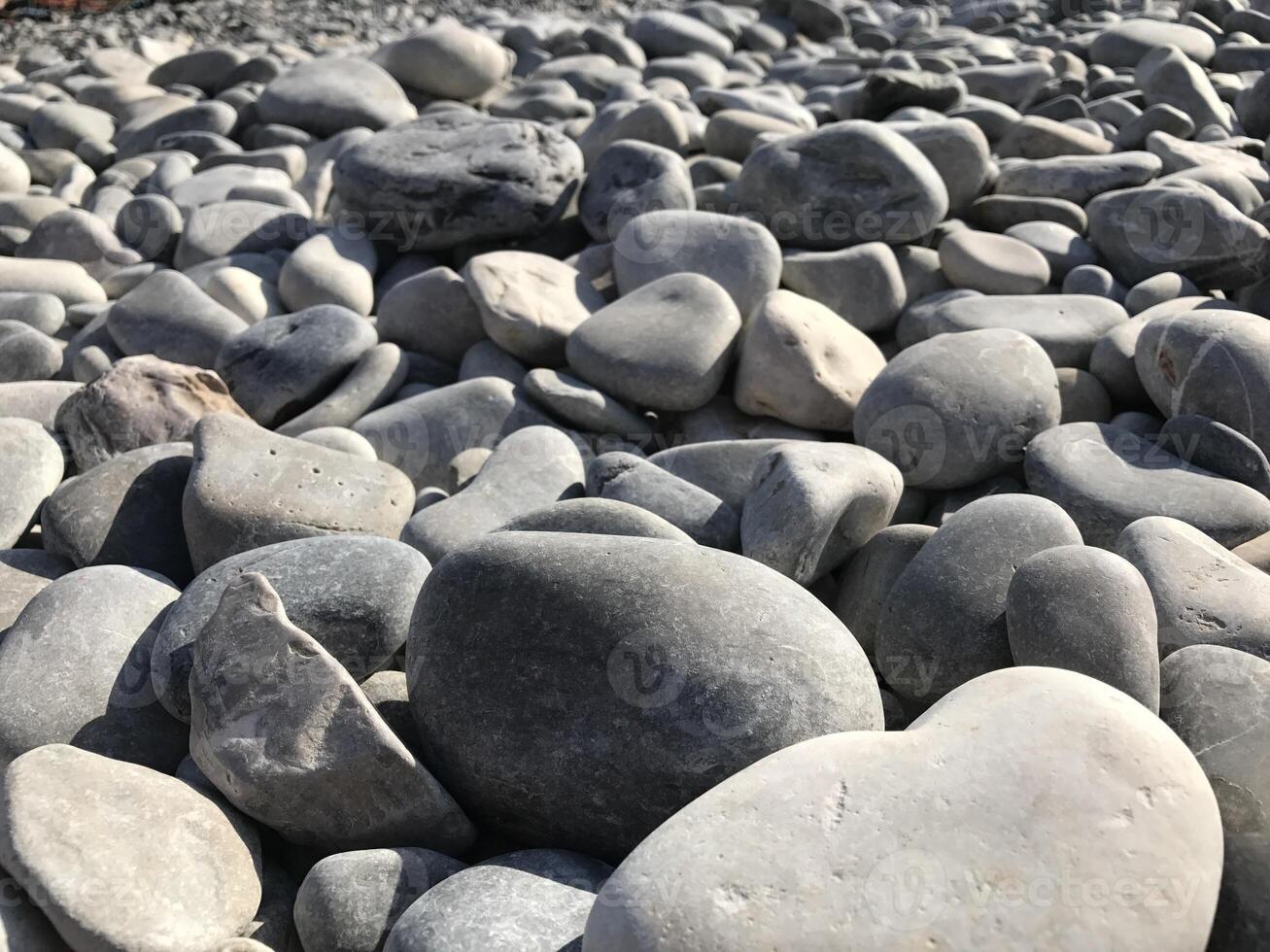 Sea stones background. Colorful small pebbles or stone in garden. Flat lay of sea stones texture background. Abstract shape pattern from nature. photo