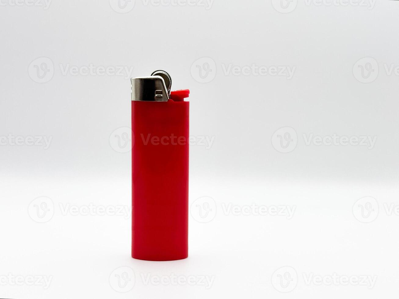 Red plastic lighter on a white background in full length side view photo