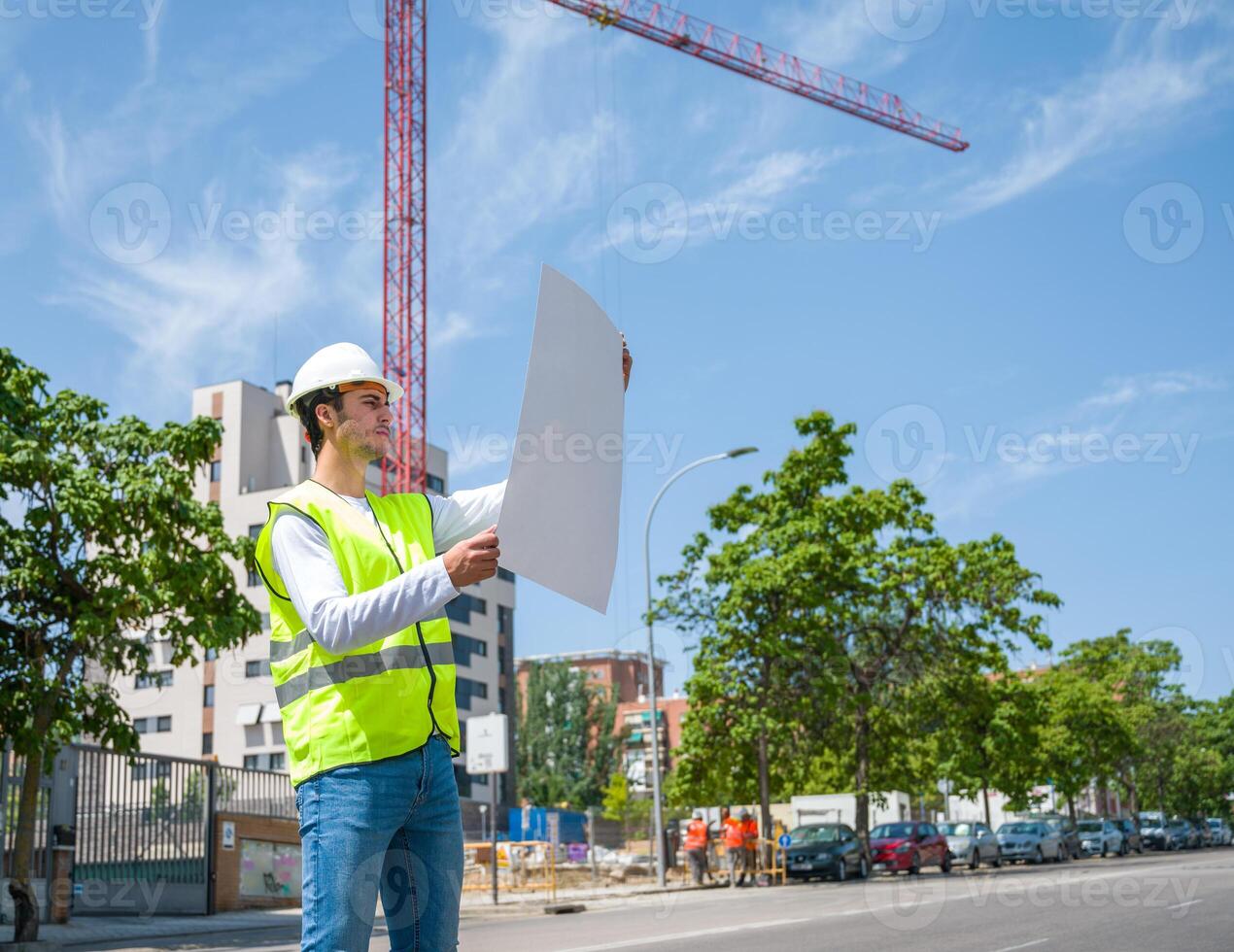 Professional young male construction worker with safety helmet and reflective vest2 photo