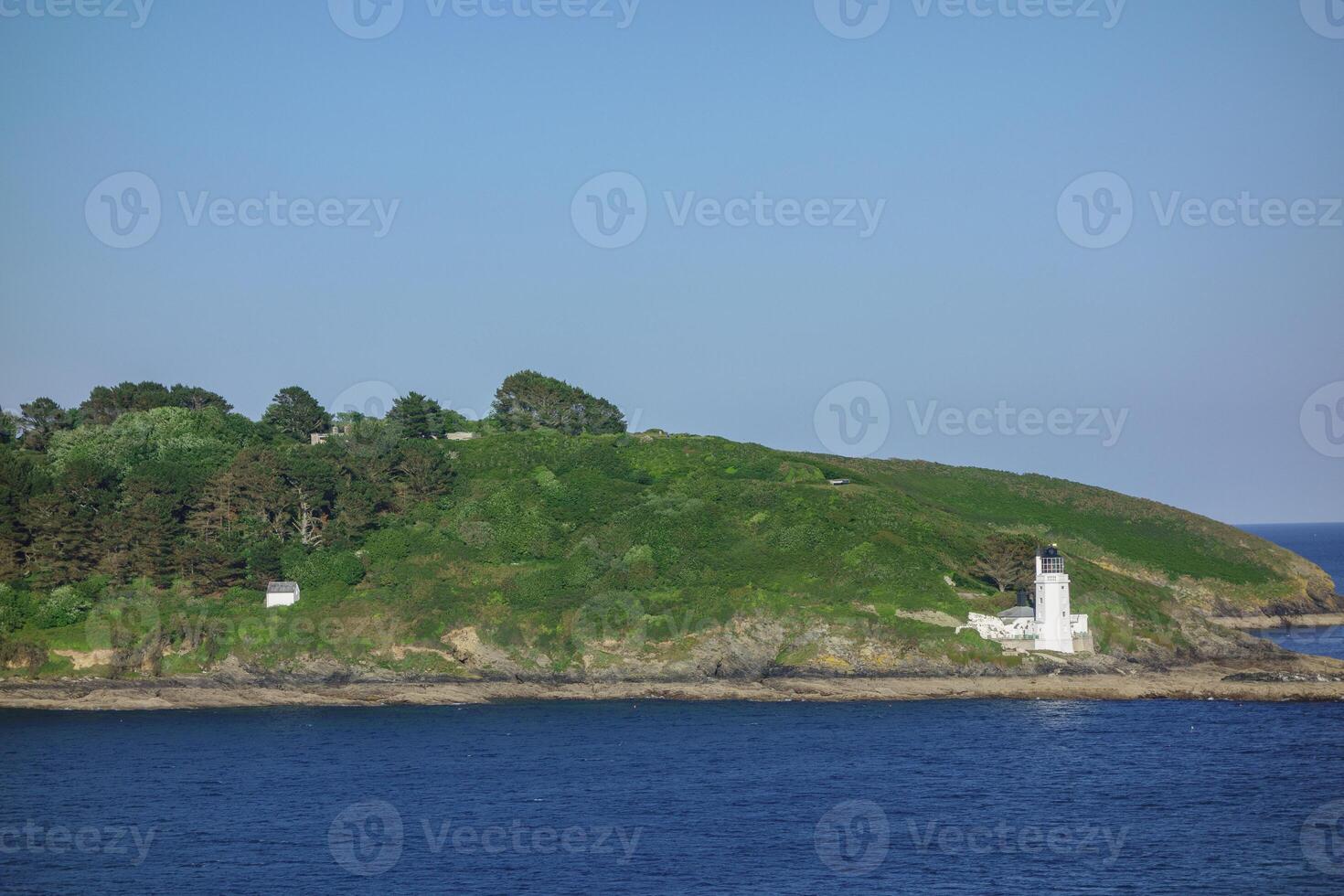 white lighthouse in cornwall photo