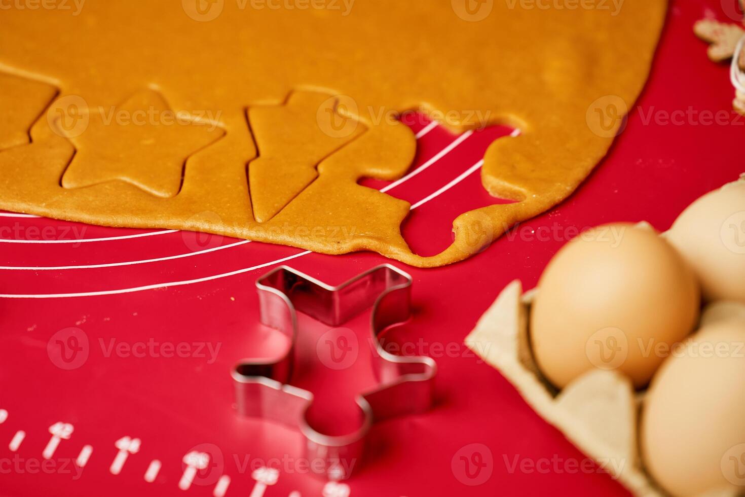Gingerbread dough with cookie cutters photo