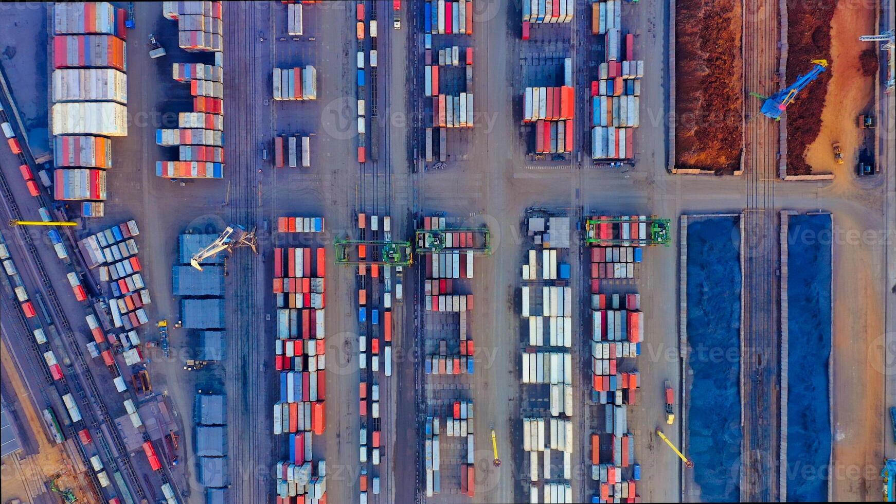 Aerial view of the port cargo area with containers, bulk cargo, cranes, trucks photo
