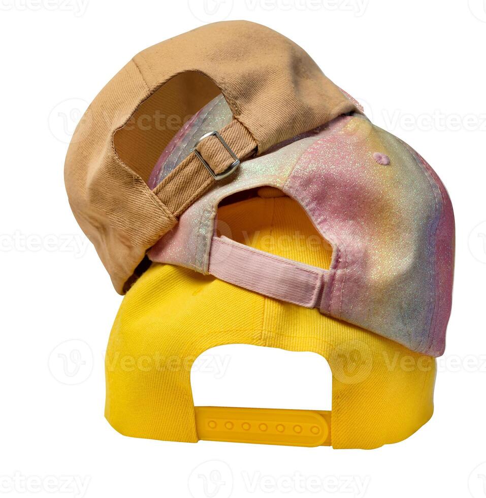 Three colorful caps back view on clasp, isolated on white background. Mockup for logo placement or use in design. photo