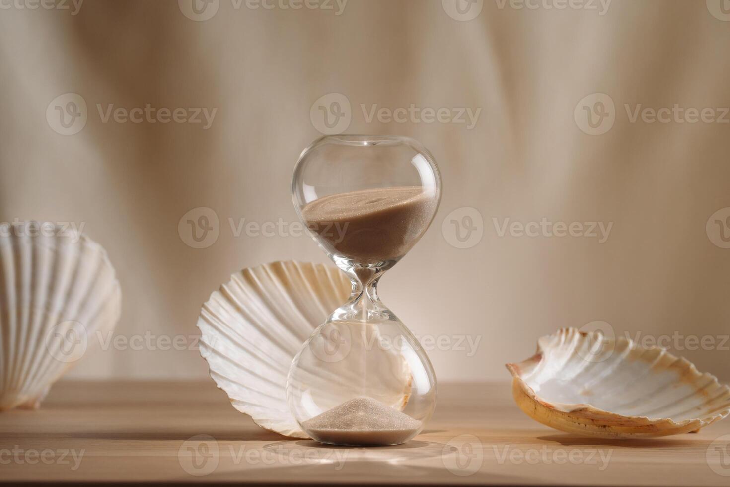 A sophisticated display featuring a delicate hourglass surrounded by elegant seashells, emphasizing the blend of minimalism, creative design, and coastal aesthetics for unique and timeless concept photo