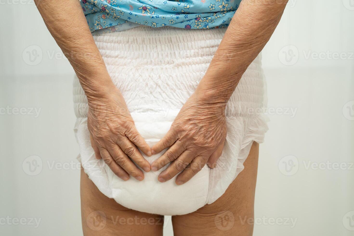 senior woman wearing diaper. photo
