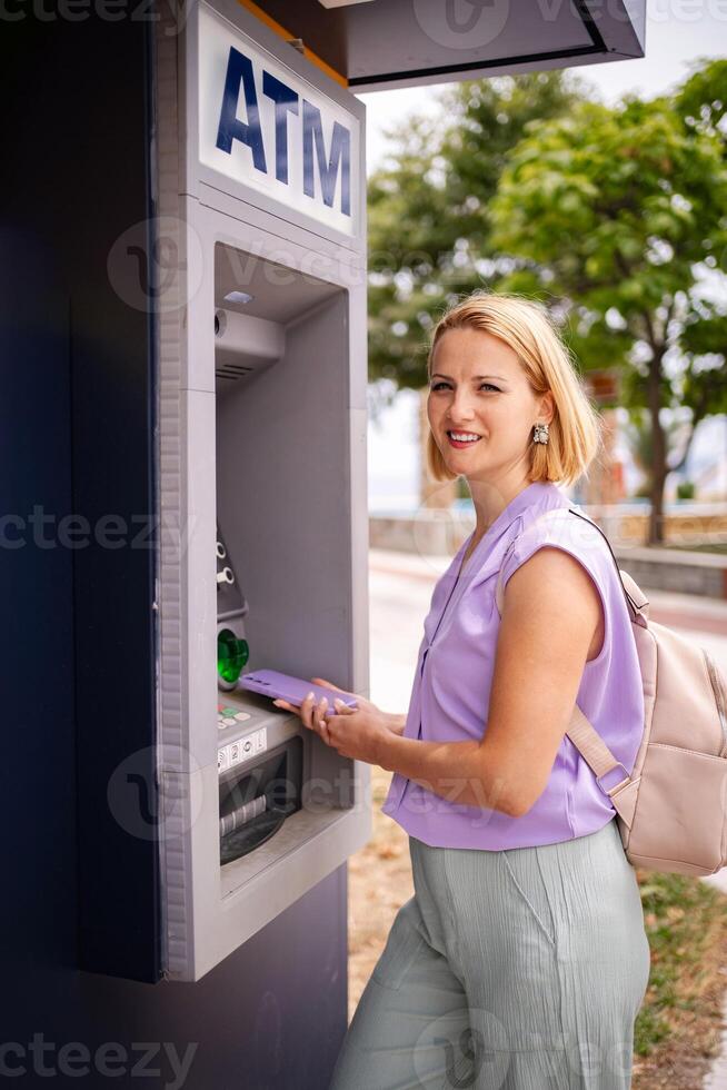 Summer moments at the ATM in Greece by the coast photo