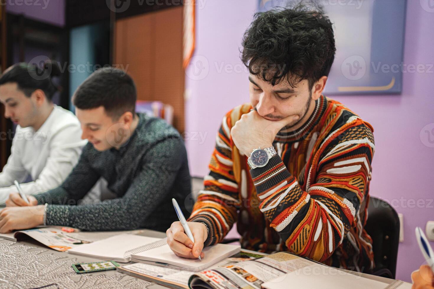 Group ofmale students studying at language school class photo